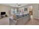 Comfortable living room with plush sofa, ceiling fan, and open view to the dining area, perfect for relaxing at 8111 Yaxley Hall Dr, Raleigh, NC 27616