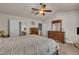 This main bedroom offers neutral color tones, carpeted floors, and is decorated with nice dark-wood furniture at 8111 Yaxley Hall Dr, Raleigh, NC 27616