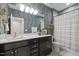 Well appointed bathroom with decorative wallpaper and a shower/tub combination at 814 Covered Bridge Trl, Chapel Hill, NC 27517