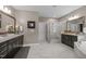 Bathroom with a dual vanity, standing glass shower and separate bath at 814 Covered Bridge Trl, Chapel Hill, NC 27517