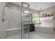 Beautiful bathroom featuring a tiled shower, a double vanity, and a soaking tub under a window at 814 Covered Bridge Trl, Chapel Hill, NC 27517