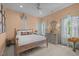 Comfortable bedroom featuring a wooden bed frame and plenty of natural light from the nearby windows at 814 Covered Bridge Trl, Chapel Hill, NC 27517