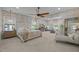 Spacious bedroom featuring neutral decor, large windows, and a seating area at 814 Covered Bridge Trl, Chapel Hill, NC 27517