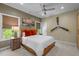 Bright bedroom with a ceiling fan, modern decor, and a large comfy looking bed at 814 Covered Bridge Trl, Chapel Hill, NC 27517