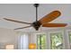 Attractive ceiling fan over a living area with lots of light from the backyard at 814 Covered Bridge Trl, Chapel Hill, NC 27517