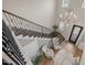 Bright foyer with decorative chandelier, hardwood floors, patterned rug and accent chairs at 814 Covered Bridge Trl, Chapel Hill, NC 27517