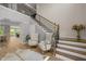 Grand foyer with a staircase and seating area featuring arm chairs, showcasing a welcoming space at 814 Covered Bridge Trl, Chapel Hill, NC 27517
