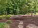 Relax in this backyard hammock and enjoy the peace and tranquility offered by the mature landscaping at 814 Covered Bridge Trl, Chapel Hill, NC 27517