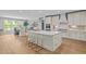 Bright kitchen with a large center island, modern appliances, and stylish countertops at 814 Covered Bridge Trl, Chapel Hill, NC 27517