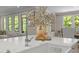 Close-up of kitchen island with a stylish faucet and greenery creating an inviting focal point at 814 Covered Bridge Trl, Chapel Hill, NC 27517