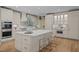 Spacious kitchen featuring a large island with seating, stainless appliances, and ample cabinet space at 814 Covered Bridge Trl, Chapel Hill, NC 27517