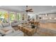 Open-concept living room with lots of windows for natural light, flowing into the kitchen area at 814 Covered Bridge Trl, Chapel Hill, NC 27517
