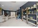 Spacious living area with stylish decor, a large comfortable sofa and decorative wood shelving at 814 Covered Bridge Trl, Chapel Hill, NC 27517