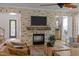 Inviting living room with a brick fireplace and a mounted television for cozy entertainment at 814 Covered Bridge Trl, Chapel Hill, NC 27517