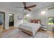 Comfortable main bedroom with a king bed, wood floors, private bathroom and lots of natural light at 814 Covered Bridge Trl, Chapel Hill, NC 27517