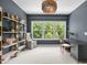 Well-lit office space featuring a modern desk, comfortable chair and decorative shelving at 814 Covered Bridge Trl, Chapel Hill, NC 27517