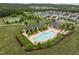 Resort-style pool with a large sundeck, lounge chairs, and clubhouse, nestled in a vibrant residential community at 814 Covered Bridge Trl, Chapel Hill, NC 27517