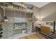 Storage room with custom shelves, desk, and hardwood floors at 814 Covered Bridge Trl, Chapel Hill, NC 27517