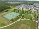 Scenic view of tennis courts and community park, surrounded by well-manicured landscaping and walking paths at 814 Covered Bridge Trl, Chapel Hill, NC 27517