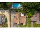 Aerial view of the home showcasing a backyard pool, lush landscaping, and inviting outdoor spaces at 821 Woodburn Rd, Raleigh, NC 27605
