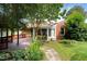 The backyard features a deck and patio that are surrounded by lush greenery and a well-maintained yard at 821 Woodburn Rd, Raleigh, NC 27605