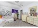 Cozy bedroom features neutral carpet, ceiling detail and off-white furniture at 821 Woodburn Rd, Raleigh, NC 27605
