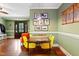 Cozy dining area with colorful chairs, modern lighting, and convenient access to living room at 821 Woodburn Rd, Raleigh, NC 27605