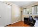 Home office featuring a desk, chair, hardwood floors and a window at 821 Woodburn Rd, Raleigh, NC 27605