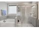 Bathroom featuring a tub and a shower at 8909 Tara Hill Ln, Wake Forest, NC 27587