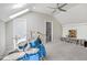 Bright bonus room featuring vaulted ceilings, neutral paint, carpet flooring and a stylish ceiling fan at 8909 Tara Hill Ln, Wake Forest, NC 27587