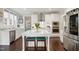 Modern kitchen with white cabinets, stainless steel appliances, and a center island with seating at 8909 Tara Hill Ln, Wake Forest, NC 27587