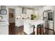 Modern kitchen boasts stainless steel appliances, subway tile backsplash, and a center island with seating at 8909 Tara Hill Ln, Wake Forest, NC 27587