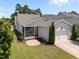 Aerial view of the home, with screened in porch, two-car garage, and beautifully landscaped yard at 1000 Groveview Wynd, Wendell, NC 27591