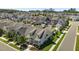 Aerial view of varied homes with lush lawns and tree coverage in a friendly residential neighborhood at 1000 Groveview Wynd, Wendell, NC 27591