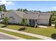Aerial view showcases the home's manicured lawn, screened in porch, and thoughtful landscaping at 1000 Groveview Wynd, Wendell, NC 27591