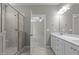 Bathroom featuring a walk-in shower and double vanity, blending style and functionality at 1000 Groveview Wynd, Wendell, NC 27591