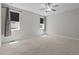 Bedroom with neutral walls, carpet, and two windows at 1000 Groveview Wynd, Wendell, NC 27591