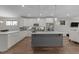 This is an updated kitchen featuring an island, stainless appliances and an open floor plan at 1000 Groveview Wynd, Wendell, NC 27591
