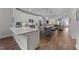 This open-concept kitchen has stone countertops, stainless appliances, and two islands at 1000 Groveview Wynd, Wendell, NC 27591