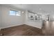 Elegant kitchen and dining area featuring hardwood floors and modern stainless steel appliances at 1000 Groveview Wynd, Wendell, NC 27591
