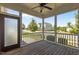 Relaxing screened porch with ceiling fan, wood floors, and neighborhood views at 1000 Groveview Wynd, Wendell, NC 27591