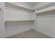Walk-in closet with shelving and carpet, designed for optimal storage and organization at 1000 Groveview Wynd, Wendell, NC 27591