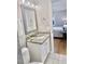 Bright bathroom featuring a granite vanity and a peek into the main bedroom at 1006 Aversboro Rd, Garner, NC 27529