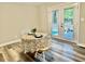 Cozy dining area with a table set for two, and French doors leading to the outdoors at 1006 Aversboro Rd, Garner, NC 27529