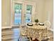 Charming dining area with wood floors and glass doors leading to the backyard at 1006 Aversboro Rd, Garner, NC 27529