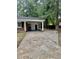 Long concrete driveway leads to the back entrance of the brick home at 1006 Aversboro Rd, Garner, NC 27529