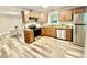Bright kitchen with modern appliances, granite counters and wood cabinetry at 1006 Aversboro Rd, Garner, NC 27529