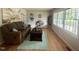 Bright living room with hardwood floors and a comfortable seating arrangement at 1006 Aversboro Rd, Garner, NC 27529