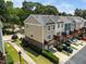 Aerial view of townhomes with garages, wooden decks, and landscaped surroundings at 1017 Frank Page Dr, Cary, NC 27511