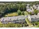 An aerial view of townhomes with manicured lawns and green spaces, creating a serene and well-maintained community at 1017 Frank Page Dr, Cary, NC 27511